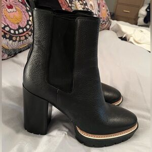 •	Tory Burch black leather lug sole ankle boots